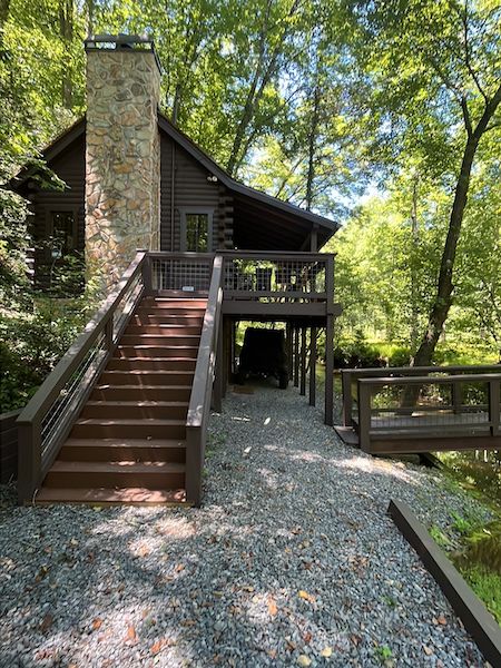 Exterior staining on a log cabin in the North Georgia woods